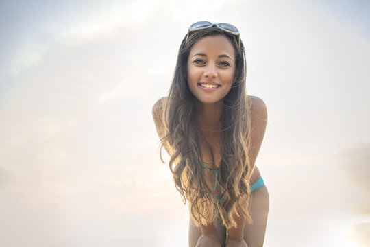 Beautiful young woman at the seaside