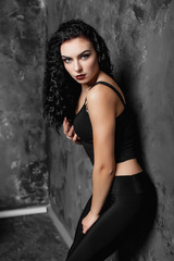 Fototapeta premium beautiful girl in the black topic and lacines in the studio 