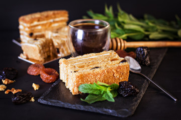 Honey cake on a dark background