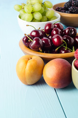 Selection of Fruit Bowls on Blue Wood Plank Table