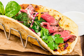 Giros with meat, vegetables and herbs