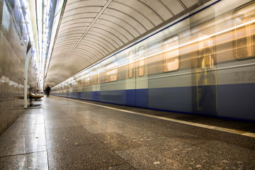 Subway metro train arriving at a station