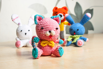 Fototapeta premium knitted toy cat, bear, rabbit, hare, handmade