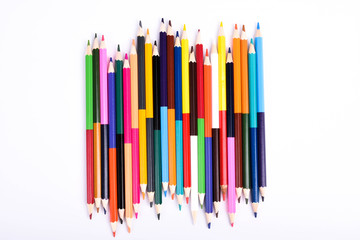  Colorful pencils pattern isolated on white background. Top view colorful of color pencils.Colored pencils, isolated on the white background. Color pencil with copy space isolated on white background,