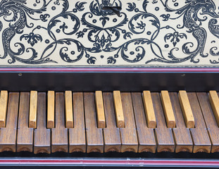 keyboard of old harpsichord with brown wooden keys