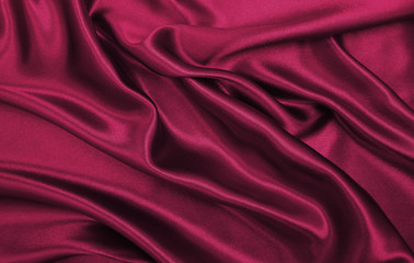Smooth elegant pink silk or satin luxury cloth texture as abstract background. Luxurious valentines...