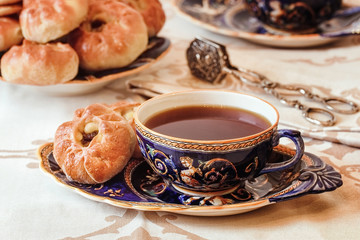 Tea drinking. Delicious homemade pies with freshly brewed tea fr