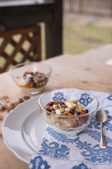 Healthy snack with yoghurt, berries and nuts on the plate