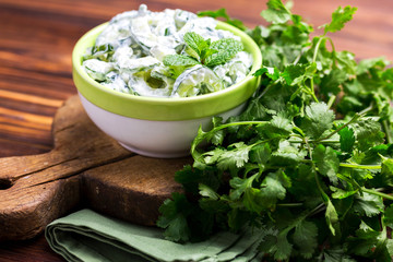 Indian cucumber raita with yoghurt, mint, cilantro. Greek tzatziki sauce