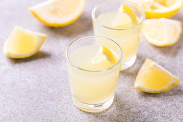 Italian lemon lime liqueur limoncello with ice and mint