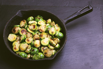 Vegetarian cuisine. Brussels Sprouts roasted with olive oil. Copyspace