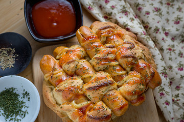 Sausage bread with dipping sauce and seasoning