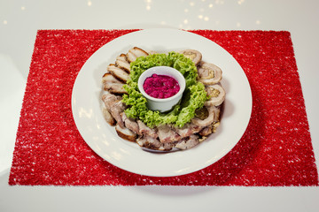 Food tray with delicious rolls, boiled pork served with marinated horseradish called as meat platter