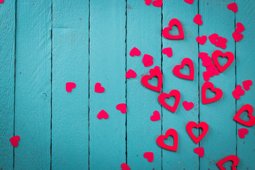 Valentine day background with red hearts, blue background top view