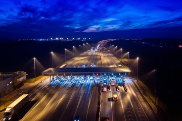 Aerial drone view on motorway with toll collection point - obrazy, fototapety, plakaty