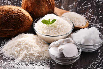 Composition with bowl of shredded coconut and shells