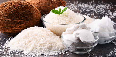 Composition with bowl of shredded coconut and shells