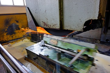 Processing of metal by grinding on a flat grinding machine, at a machine-building enterprise.