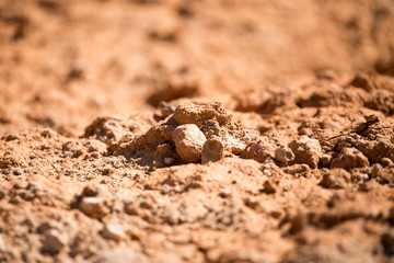 Red clay soil on nature as a background