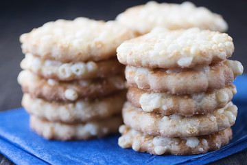 Cheese biscuits on blue paper.