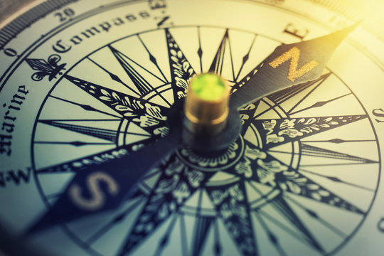 Old compass. Macro shot. Retro style.