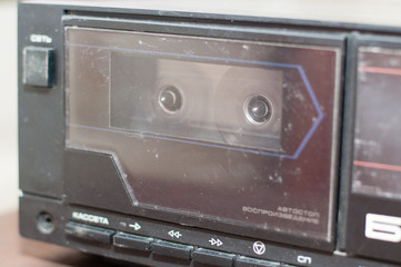 Background, old tape recorder with a cassette