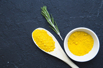 Set of specis and herbs on black stone background