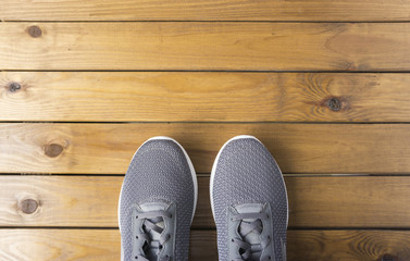 Shoes on wooden floor, top view