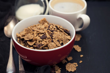 cereals with chocolate cereals in red bowl