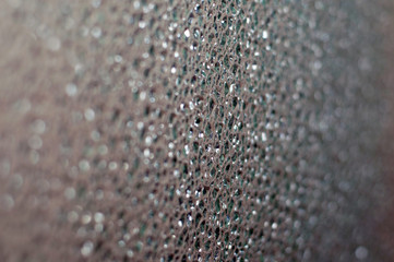 Abstract bokeh background. drops on the gray glass. Background with space for text