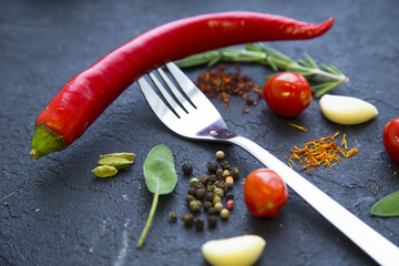 Set of specis and herbs on black stone background