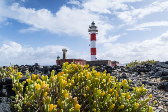 El Toston lighthouse in the north of island of Fuerteventura under beautiful sky