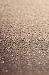 Gray abstract background of glass bokeh with space for text