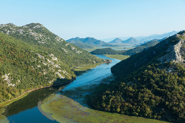 Fototapeta na wymiar River bend of the Rijeka Crnojevica river in Lake Skadar National Park, Montenegro