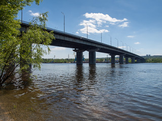 Long concrete bridge across the wide river