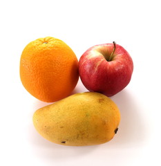 An orange, apple and a mango. White background with copy space.