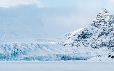 Frozen Glacier Lagoon in Iceland with Mountain Peak