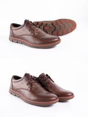 Male brown leather shoe on white background, isolated product, comfortable footwear.