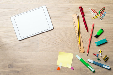 Blank tablet with copy space on desk from above