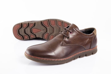 Male brown leather shoe on white background, isolated product, comfortable footwear.