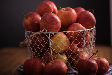 close up of red fruit apples on a wood background 