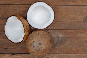 Coconut isolated on the wooden background. Tropical fruit coconut