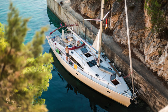 High angle portrait of man waving from yacht, Croatia