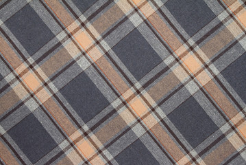 Flannel, cotton into the classic scottish cell as textile background in vintage style .