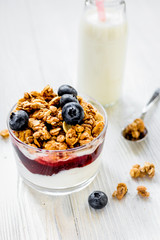 Healthy morning with granola breakfast on white kitchen table
