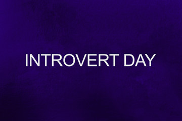 words Introvert Day on ultra violet background
