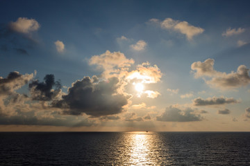 Blue sea and blue sky with white cloud and sunrise up from sea in gulf of Thailand.
