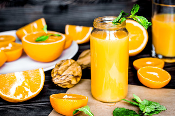 healthy morning with orange juice in bottle on kitchen backgroun