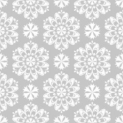 Fototapeta na wymiar White floral seamless design on gray background