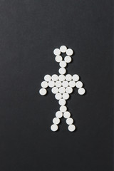 Medication white colorful round tablets arranged abstract on black background. Human, aspirin, capsule pills design. Treatment, choice healthy lifestyle concept. Copy space for advertisement.